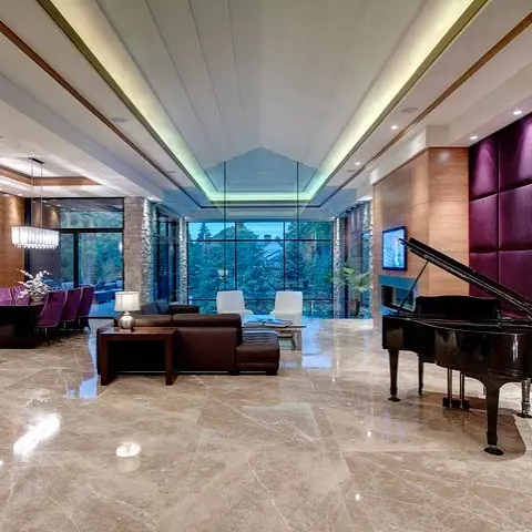 Light marble is used for the floor throughout the room, alongside a piano and generous formal living spaces.